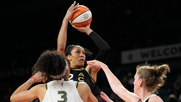 Aces forward A’ja Wilson shoots a basketball